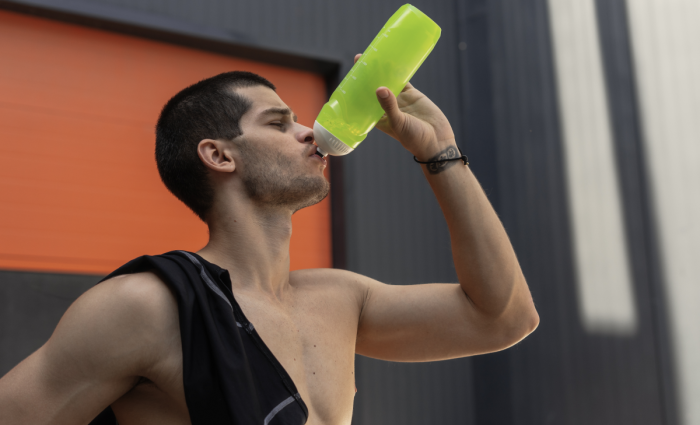 An athlete drinks free creatine supplement samples